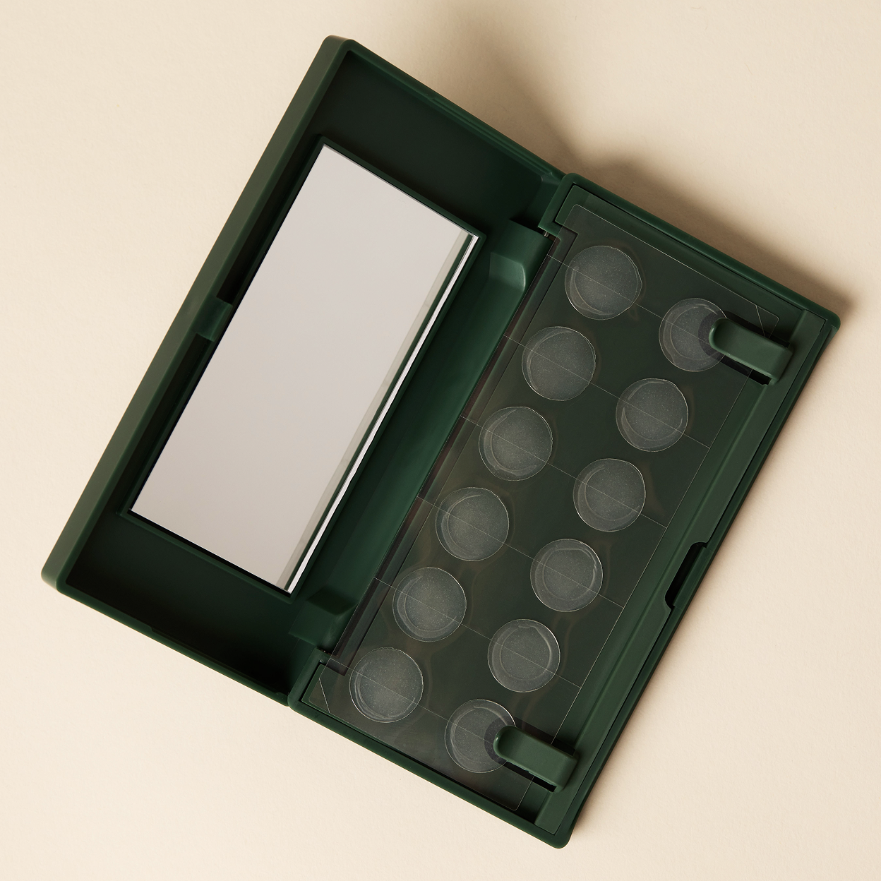 An open Just in Case pimple patch carrying case with mirror on a beige background