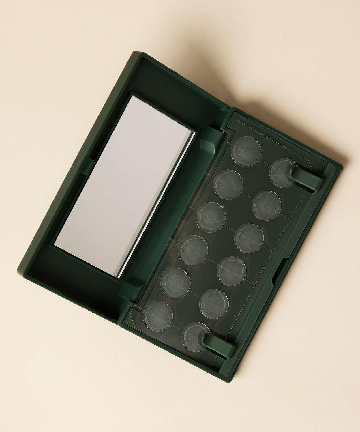 An open Just in Case pimple patch carrying case with mirror on a beige background