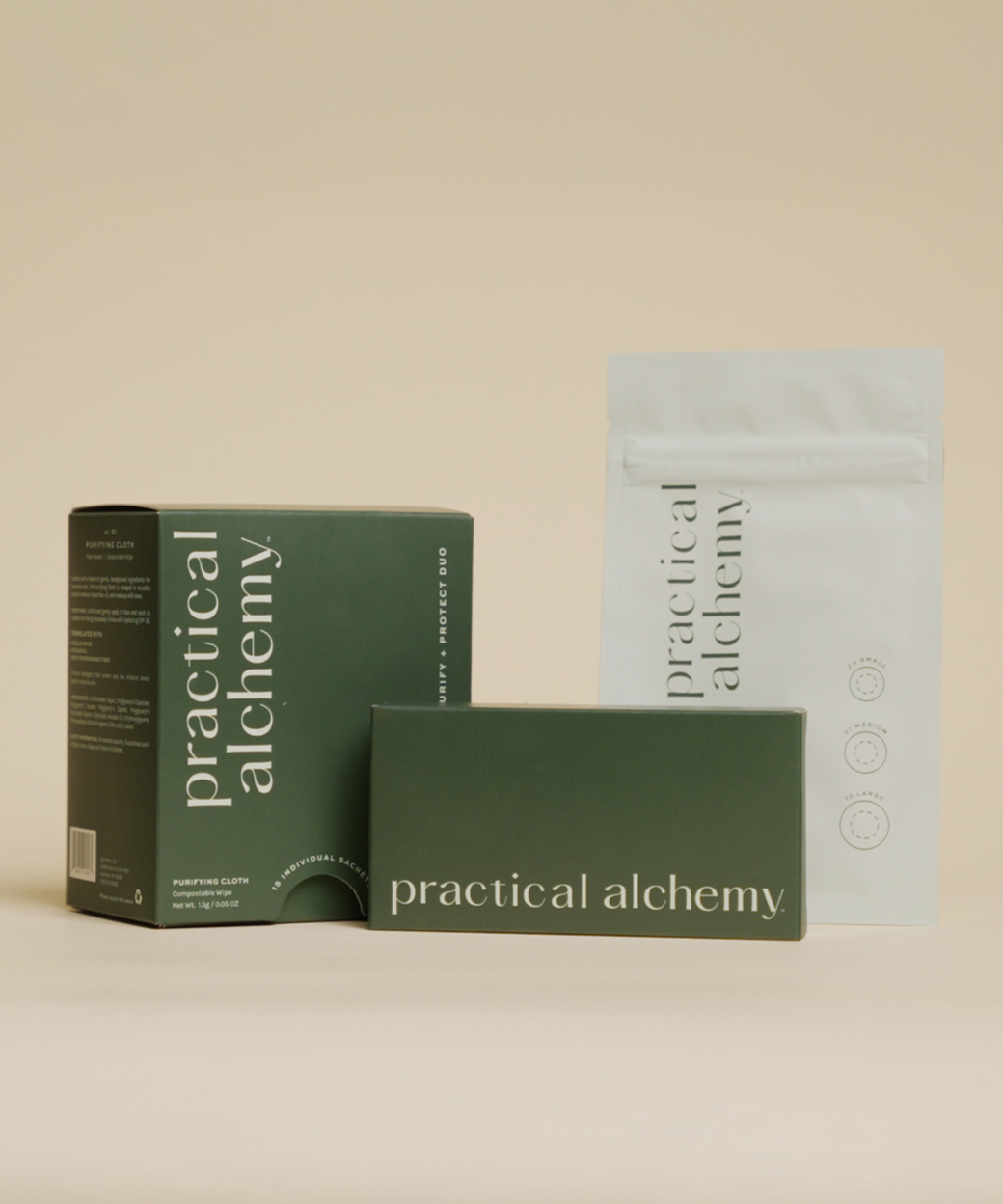 Practical Alchemy products including a box of Purify + Protect sachets, pouch of Vanishing Pimple Patches, and Just in Case carrying case on a beige background