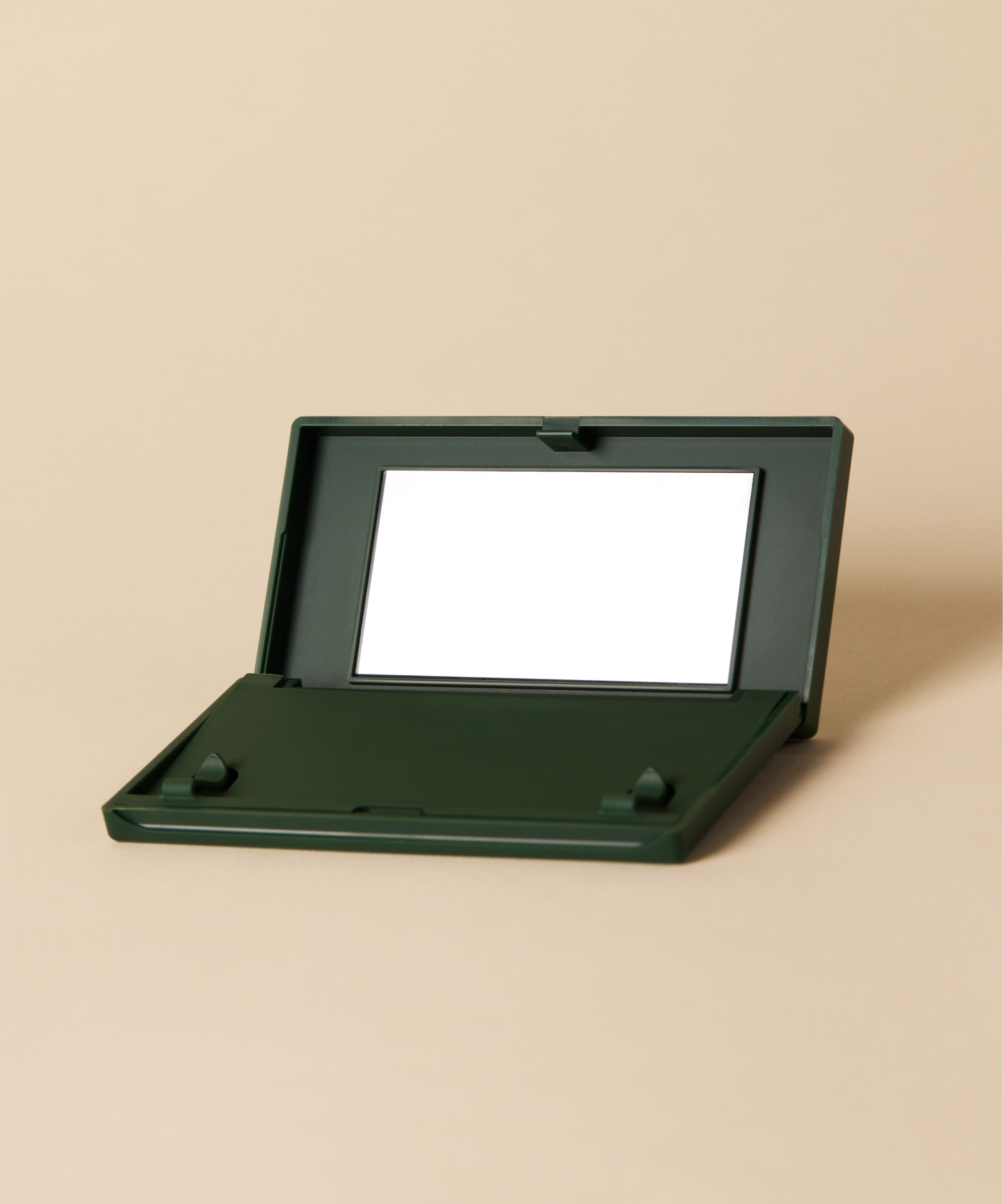 green Just in Case vanishing pimple patch carrying case on beige background