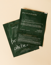 Two green sachet packets of Purify + Protect Duo on a beige background