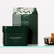 Purify and Protect Duo and Purifying Cloths boxes on a bathroom shelf